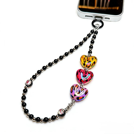 Handmade Leopard Heart Y2K Phone Chain with acrylic beads and reinforced wristlet strap.